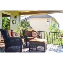 Cozy Covered Porch with Furniture Kaufman Construction Design Build.jpg